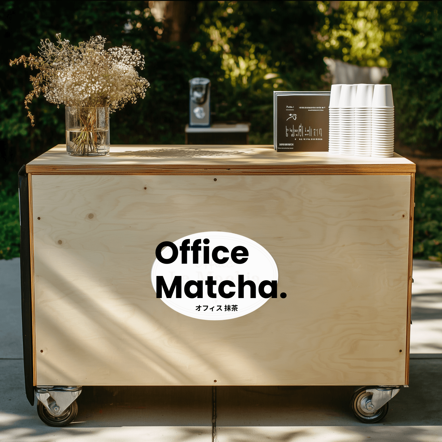 Office Matcha branded wooden cart with cups and flowers